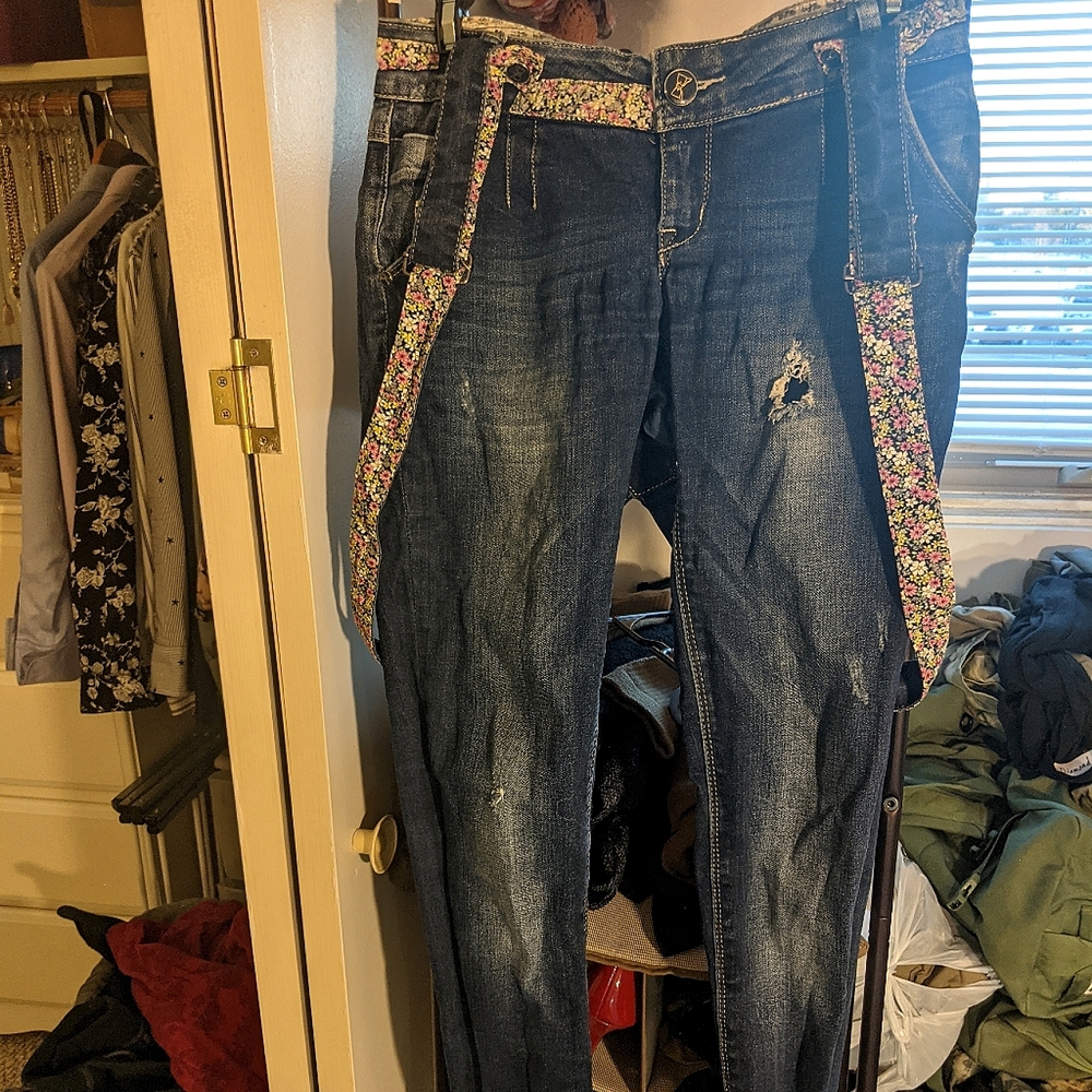 Unique skinny jeans with floral accents and matching suspenders